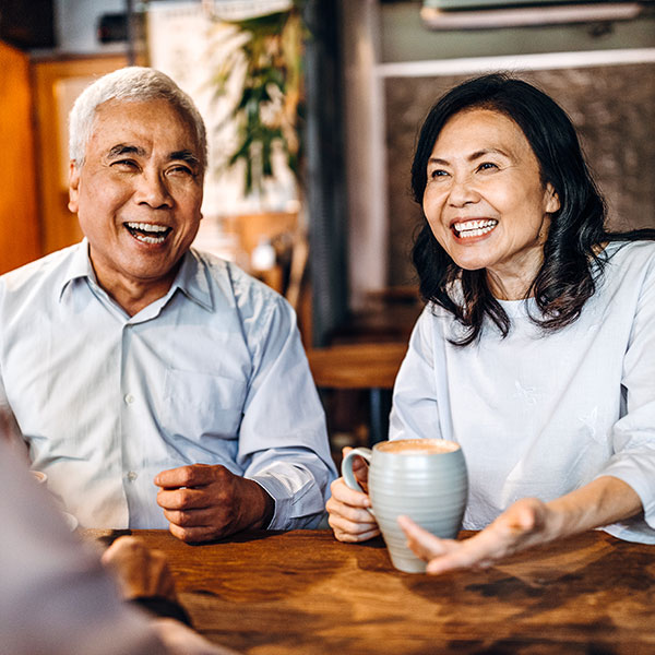 couple laughing over coffee